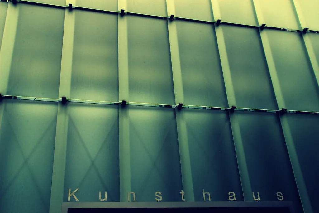 The glass facade of Kunsthaus Bregenz, a neighbouring art museum in Bregenz.