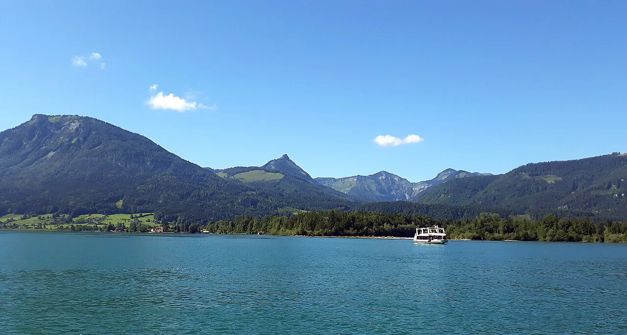 The Wolfgangsee and its surrounding mountains on a clear summer day.